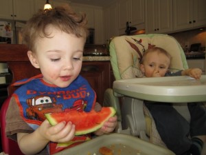 Eating the watermelon.