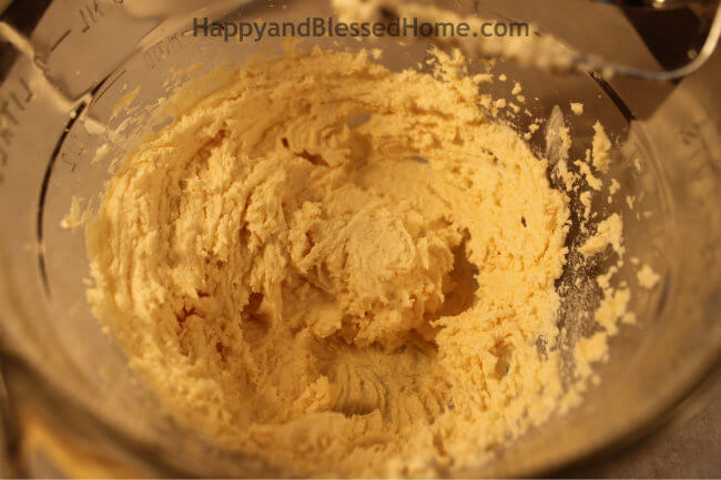Mix until creamy for the Snowflake Cookie Recipe and Cookie Decorating Tutorial HappyandBlessedHome.com