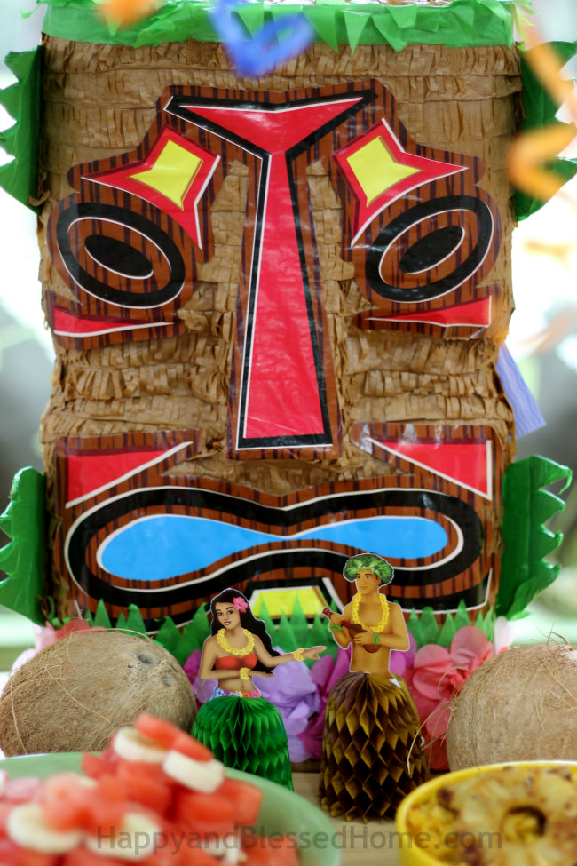 POLYNESIAN TRIBAL TIKI MASKS Decoration and Hula Dancers set the stage for a Hiwaiian themed luau party