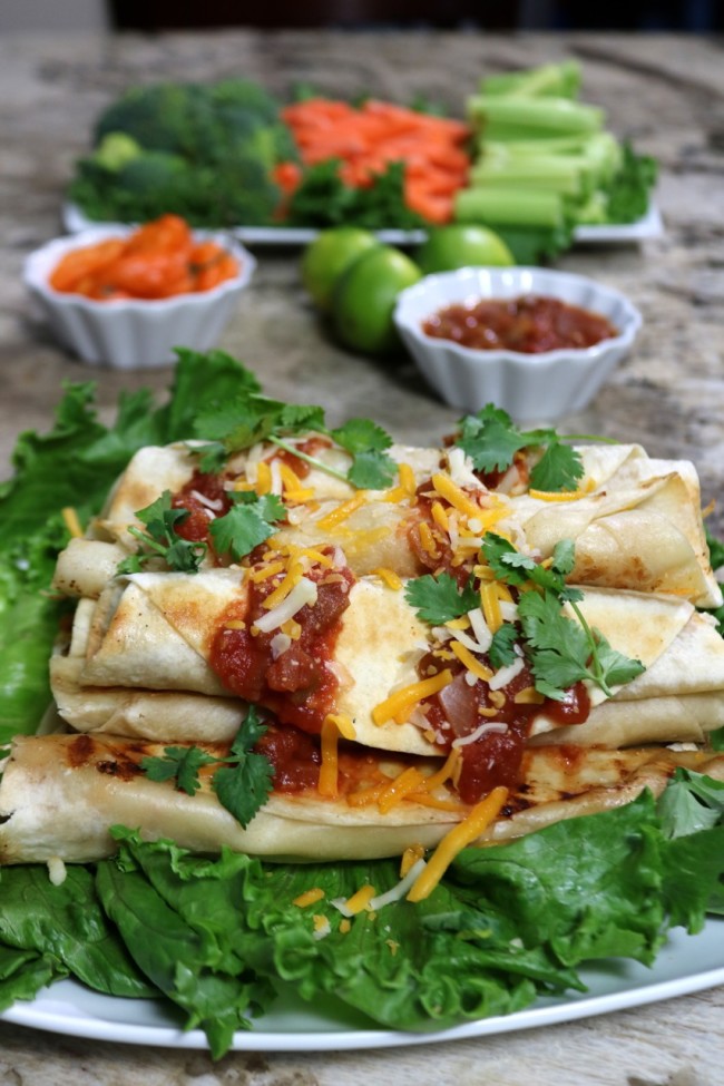 Homemade Tequila Lime Chicken Taquitos with a touch of salsa, shredded cheese and cilantro - YUM!