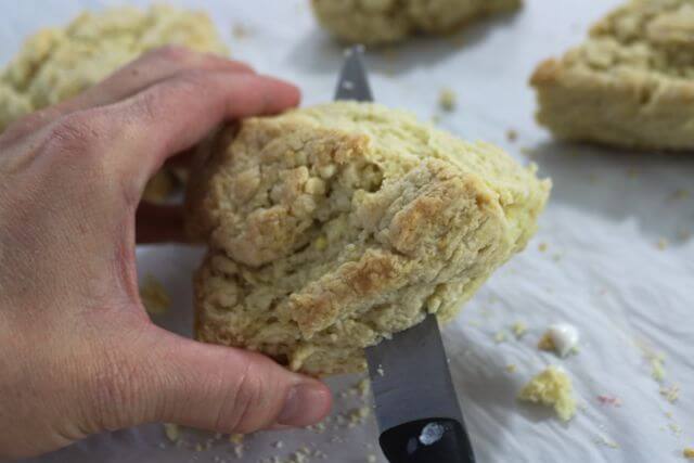 Gently cut cooked scones to add the raspberry pie filling