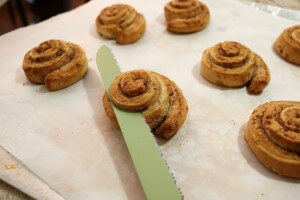 Cut the tops off of sweet rolls to make Peanut butter frosted reindeer rolls