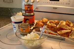 Mash the potatos to make LA MORENA® Jalapeño Popper Twice Baked Potatoes with adobo sauce