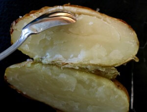 Split the baked potatoe and hollow core to create Twice-Baked Jalapeño Poppers