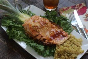 Served on a pineapple plank this Easy Recipe for wild Alaska salmon with Teriyaki and Pineapple pairs perfectly with rice