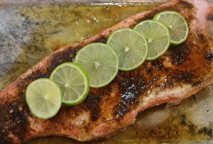 Topped with Lime slices this Easy Recipe for wild Alaska salmon with Tequila Lime Glaze tastes amazing